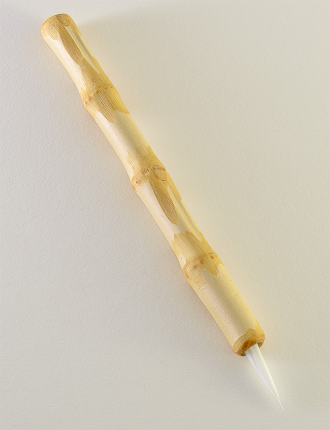 Medium size 1.” bristle length Stiff White Synthetic, with Wangi bamboo handle.