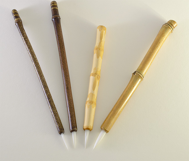 Brush set with small, medium, wangi medium, and large size 1.5” bristle length Stiff White Synthetic, with bamboo cane handles.